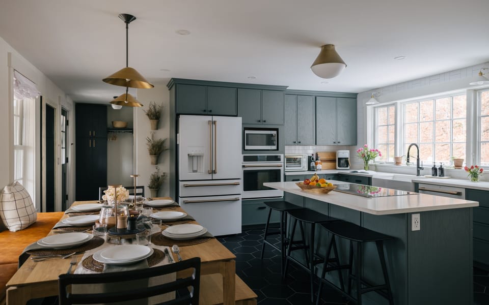 Bright and stylish gourmet kitchen with a modern design, top tier appliances, and plenty of space for entertainment