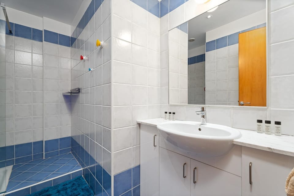 Shared bathroom with walk-in shower