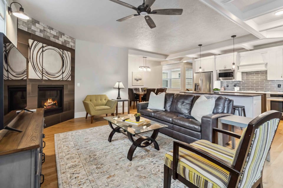 Enjoy the spacious great room and get cozy next to the fireplace on chilly nights in