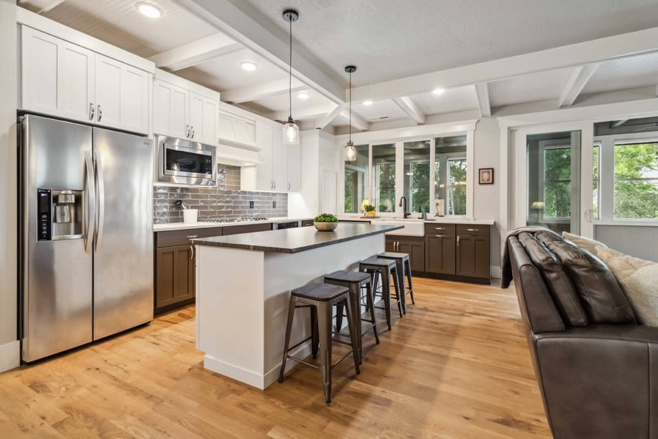 Modern fully-equipped kitchen with stainless steel, high-end appliances
