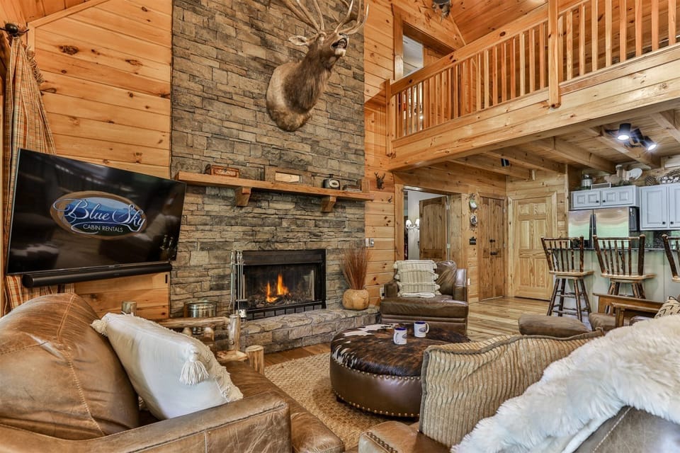 The Grand Living Room With Real Stone Gas Fireplace 