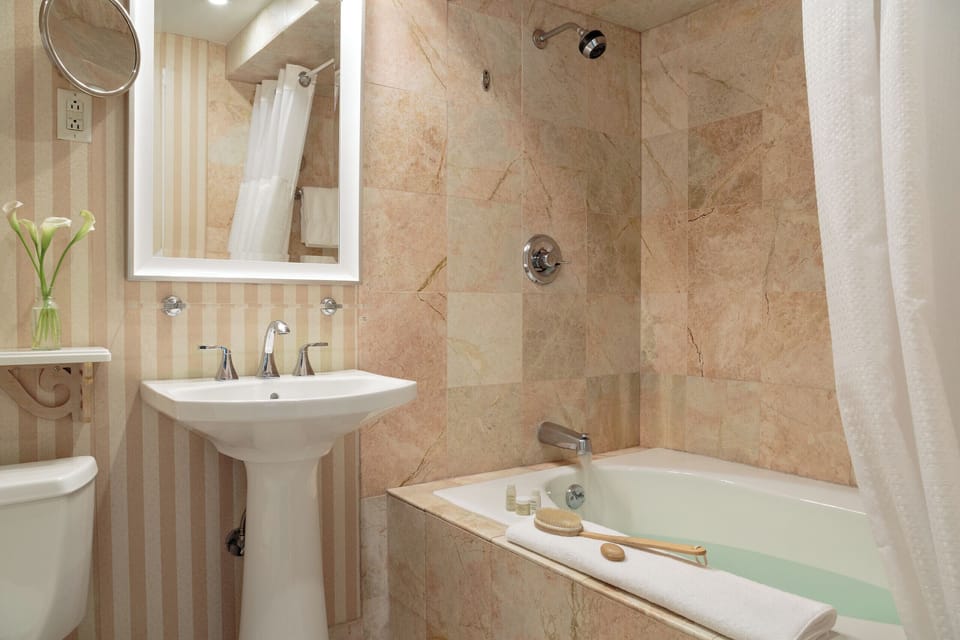 Combined shower/tub, deep soaking tub, designer toiletries, hair dryer