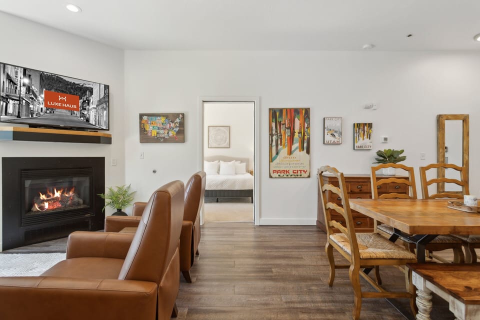 a cozy living room with fireplace and comfy seating