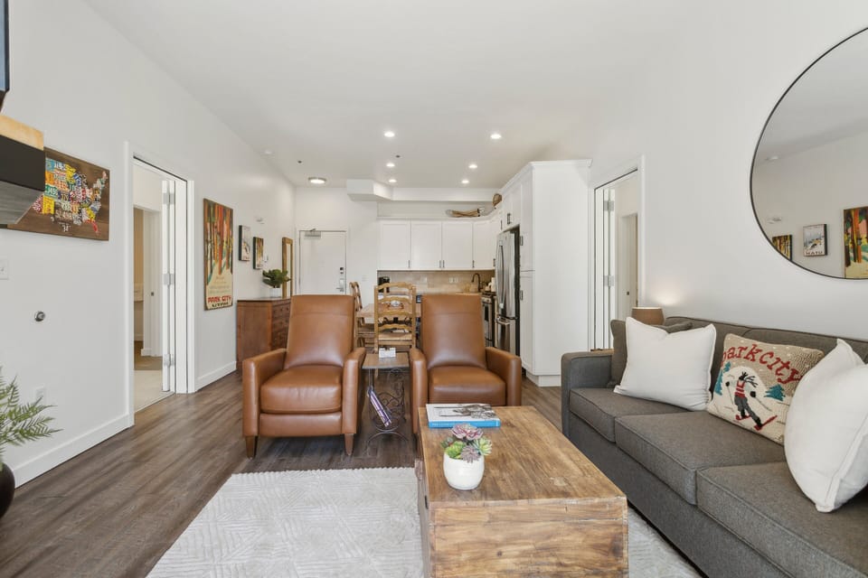 living room with couch and overstuffed chairs