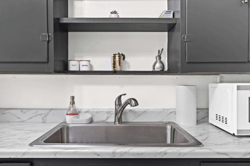 Kitchen: Unit 1 - Cook with ease in this functional kitchen featuring updated appliances and essentials.