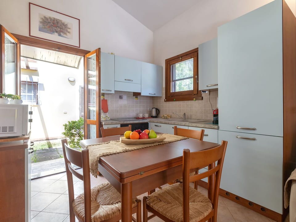 Furniture, Wood, Flooring, Kitchen, Interior Design, Kitchen Appliance, Countertop, Floor, Major Appliance, Cabinetry