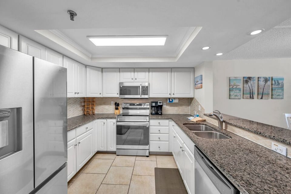 Fully equipped kitchen w/ modern appliances, ample counter space, and everything needed to cook at home.