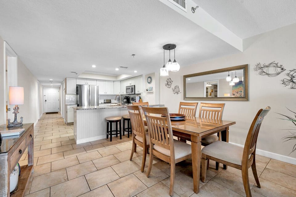 Open dining area flows into the kitchen, ideal for easy meals & relaxed gatherings.