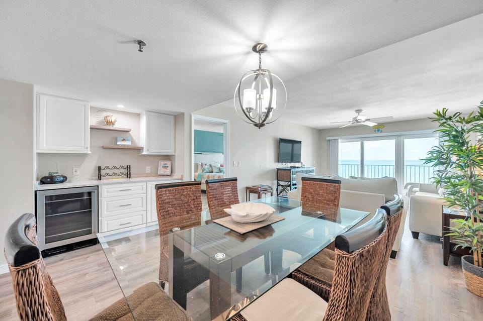 Open-concept kitchen & dining area designed for easy meals, conversation, & gathering together.