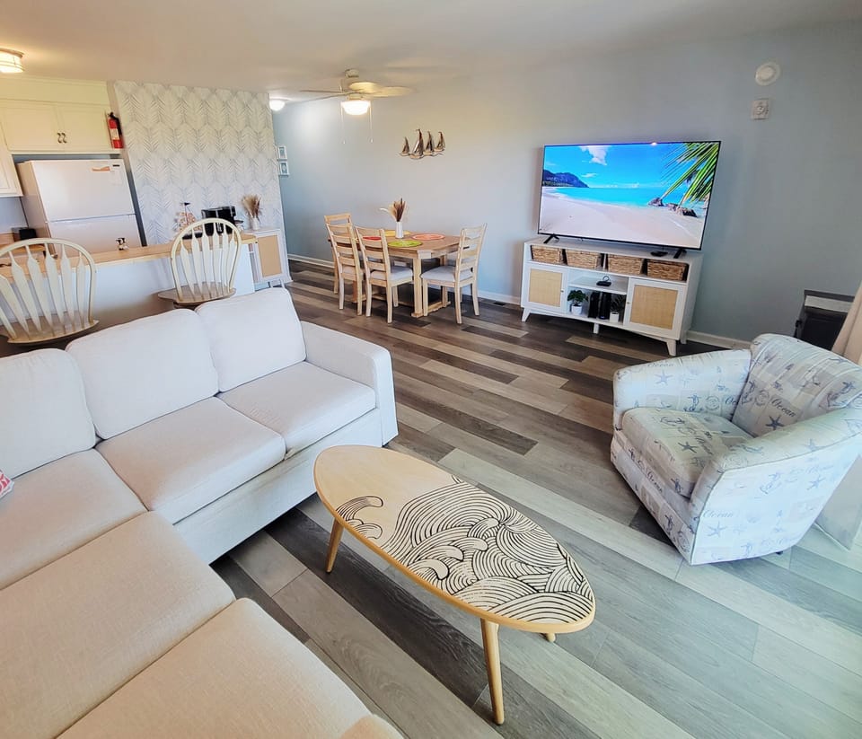 Large open living room with 65" Amazon Fire TV.  