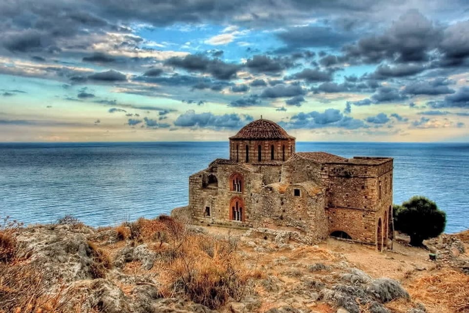 A cozy bedroom with a view of the sea and Monemvasia’s iconic Castle

