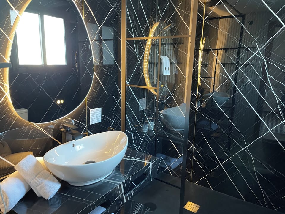 Shower, eco-friendly toiletries, hair dryer, towels