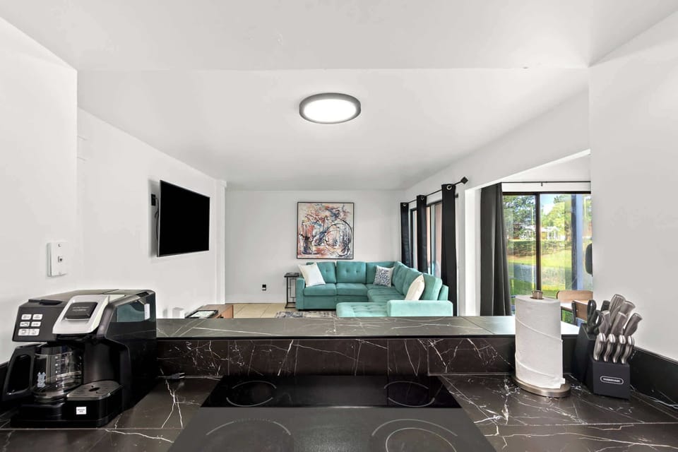 Our modern kitchen features an open-concept layout that flows effortlessly into the living and dining area, perfect for enjoying meals and quality time together.