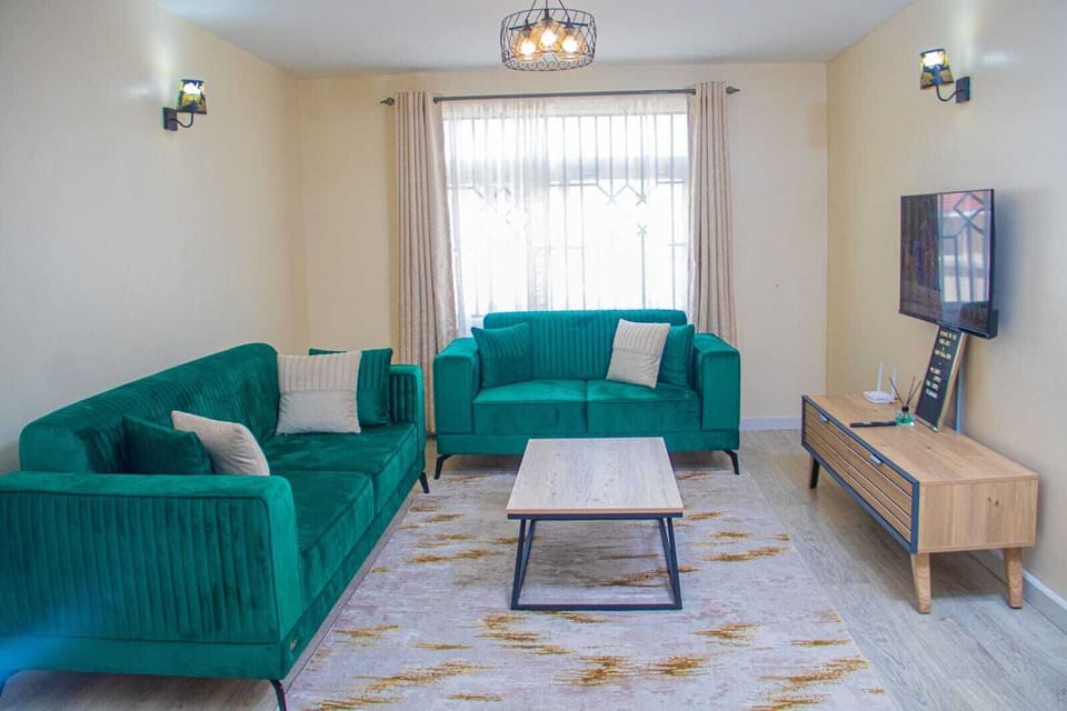 Comfort Apartment, City View | Living area | 24-inch Smart TV with digital channels