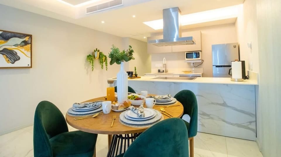 The dining table can comfortably accommodate 4 guests for sit-down meals