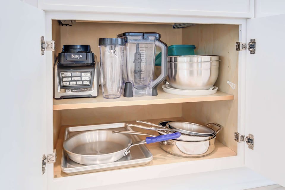 From blending to cooking, this kitchen has it all. A blender, pots, pans, and bowls for every dish you desire.