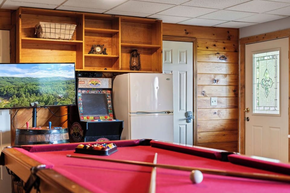 Play pool, arcade games & grab drinks from the mini-fridge—fun awaits!