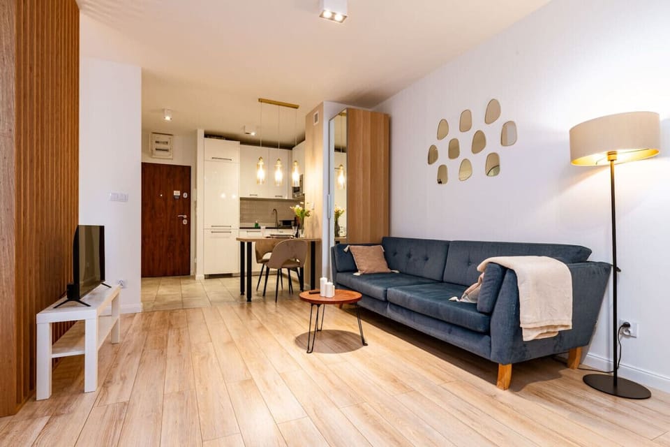 Living Area with Sofa Bed, Smart TV and Dining Table | Book Now with RENTUJEMY.COM