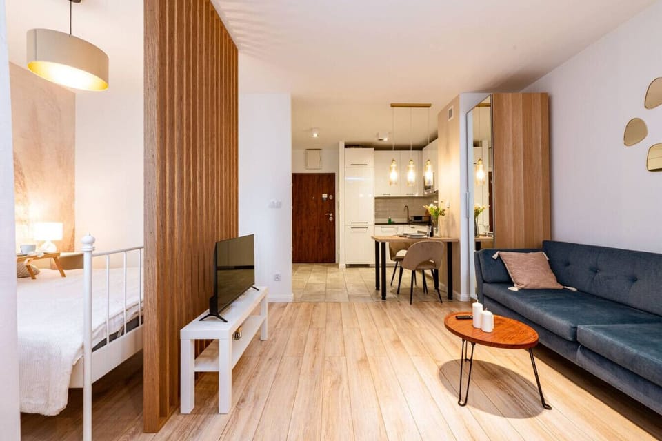 Living Area with Sofa Bed, Smart TV and Dining Table | Book Now with RENTUJEMY.COM