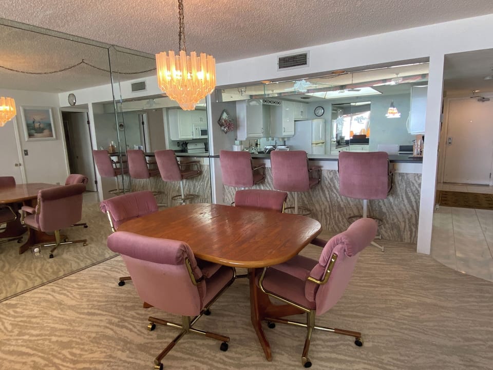 Dining space complete with extra seating at the breakfast bar.