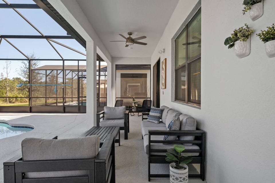 Seating area on private screened in pool patio