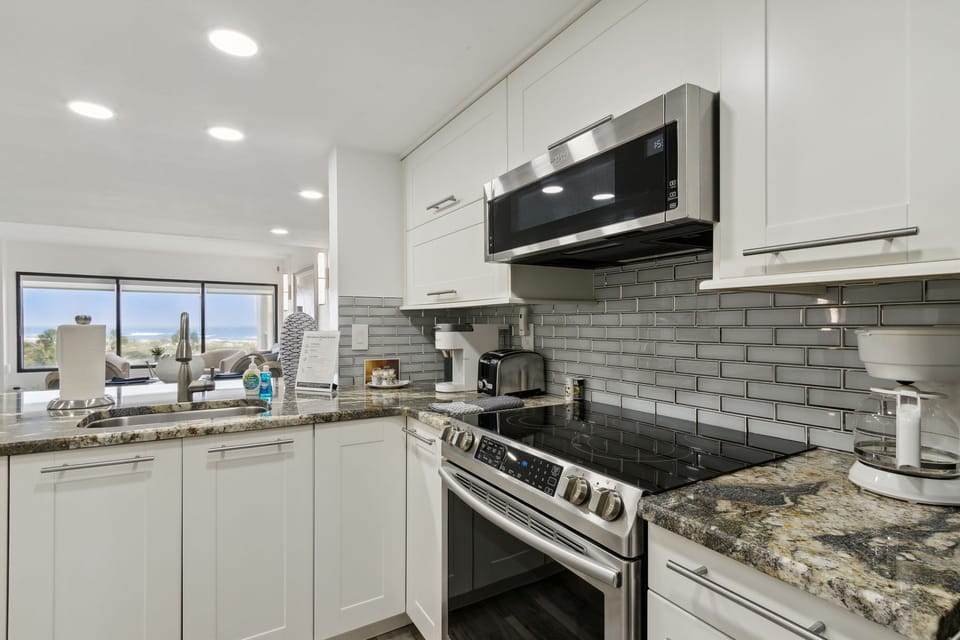 Updated Kitchen with Granite Countertops and Stainless Steel Appliances