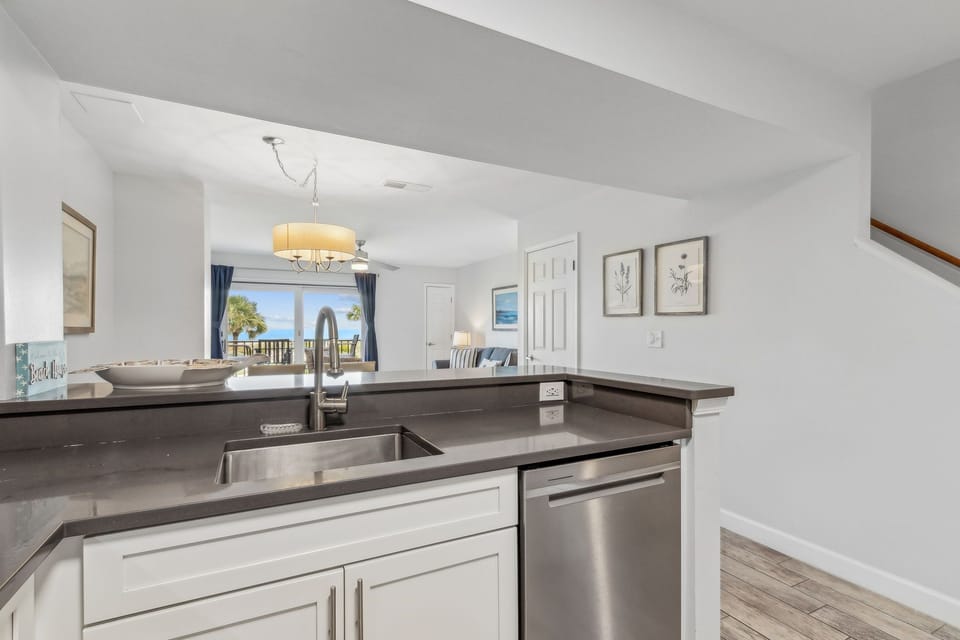 Luxury Fully Equipped Kitchen with Beautiful White Cabinetry, Granite Countertops, and Stainless Steel Appliances