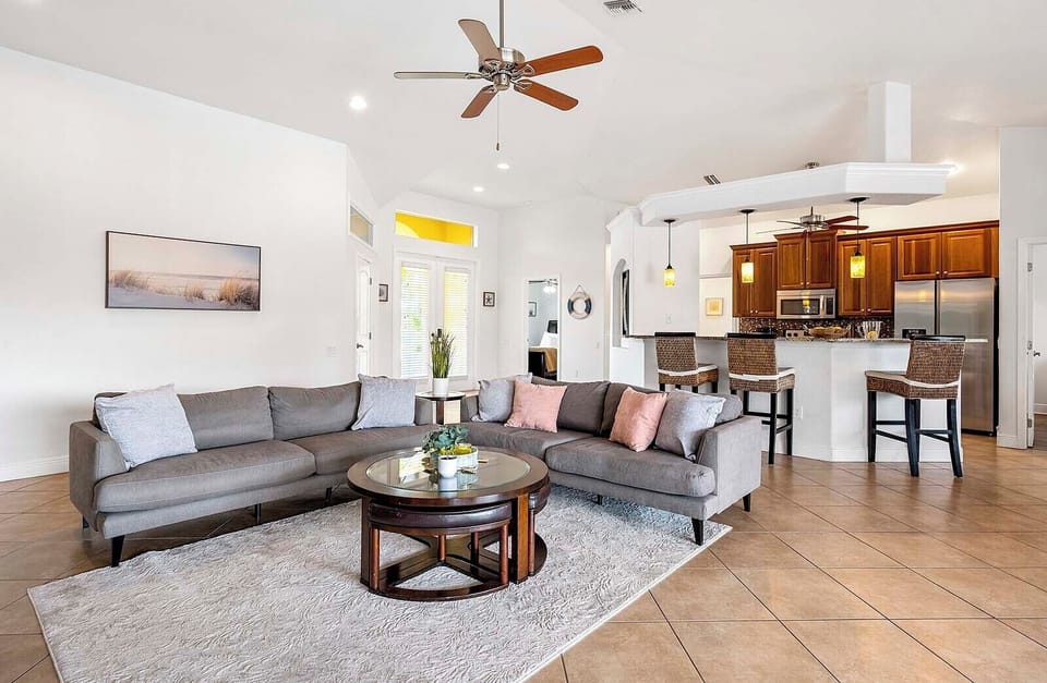 Living Room with Comfortable Couch Open to Kitchen