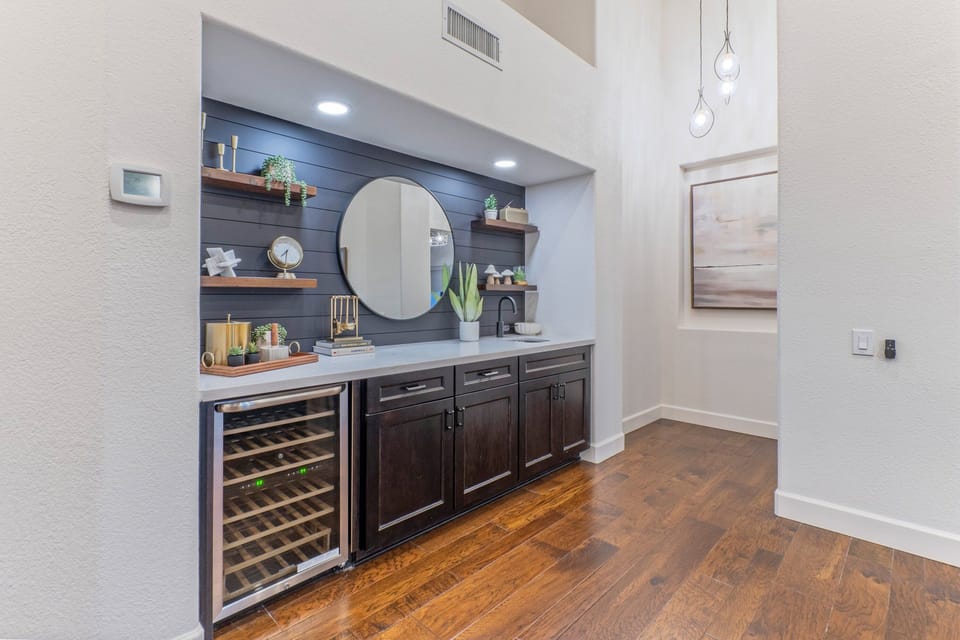 Mix your favorite cocktails at the wet bar with wine fridge