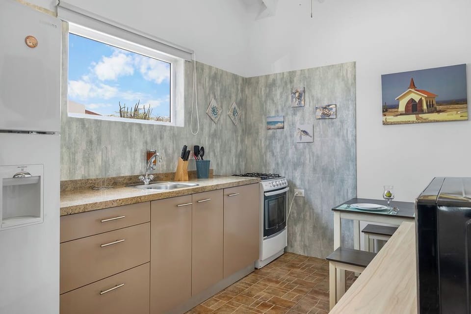 Each poolside apartment features a full kitchen and dining area, ideal for guests who enjoy privacy or separate mealtime routines.