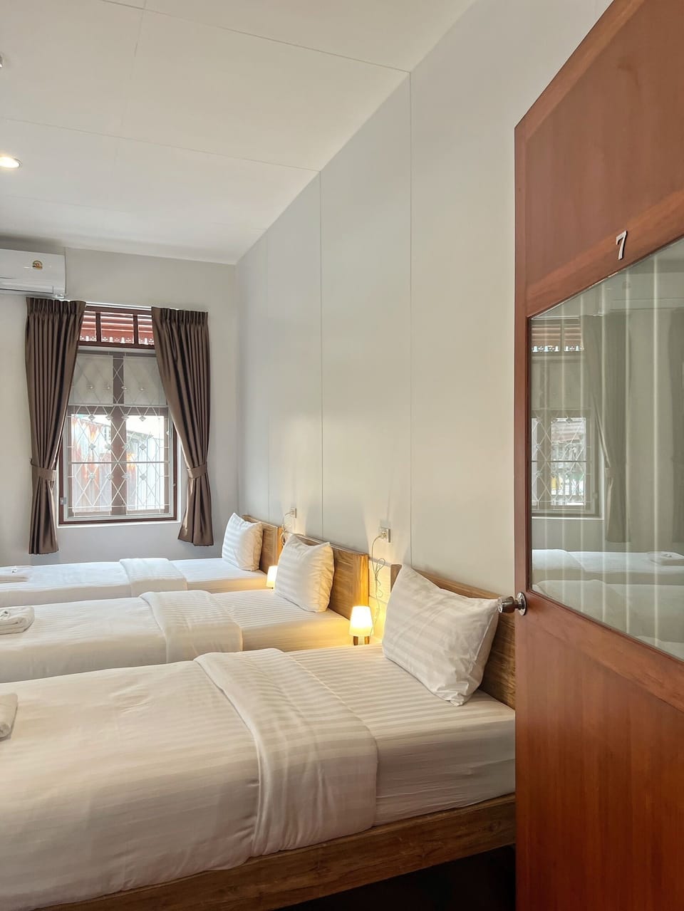 Deluxe Triple Room | Free minibar, desk, laptop workspace, blackout drapes