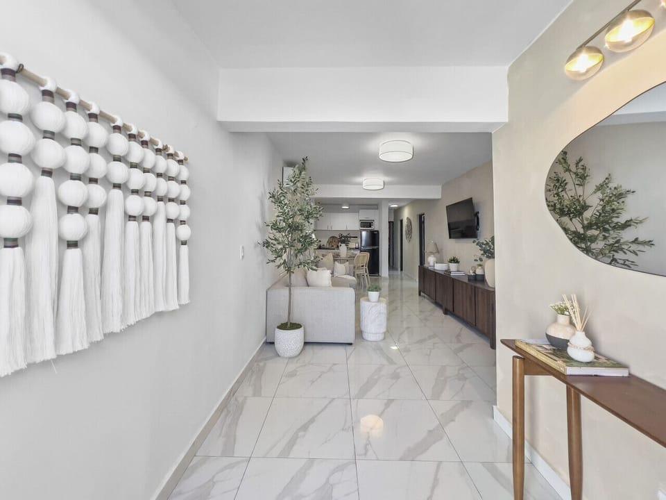 Settle into a calming living room where soft lighting and thoughtful details make every moment feel easy and comfortable