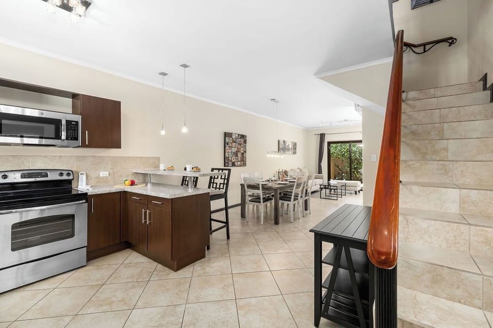 Prepare for effortless entertaining! Our open-concept design seamlessly connects the fully equipped kitchen with the spacious dining area, making it perfect for group gatherings and memorable meals.