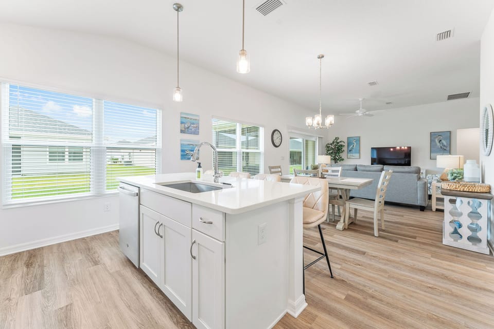 Open Concept: Kitchen, Dining and Living Room with an Abundance of Windows for Natural Light. 