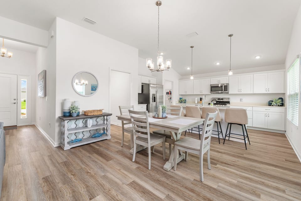 Coming into the Open Concept with Laundry Area to the left of the Dining Area