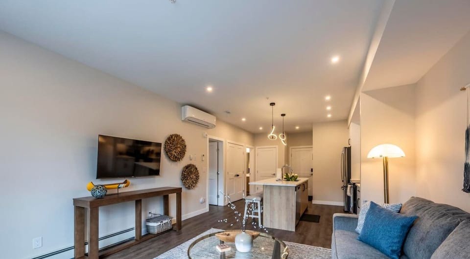Our open-concept design seamlessly connects the cozy living area with the functional kitchen, creating a perfect space for relaxation, dining, and socializing.