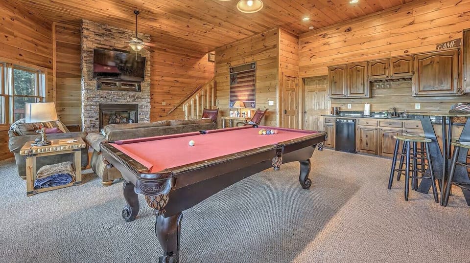Lower level pool table at this pet-friendly cabin rental in North Georgia