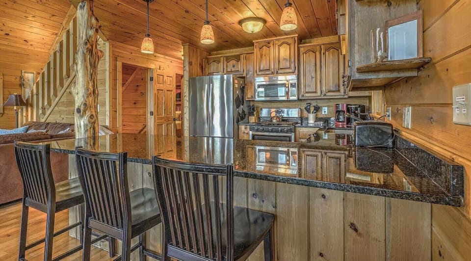 Spacious kitchen with granite and extra seating at the bar