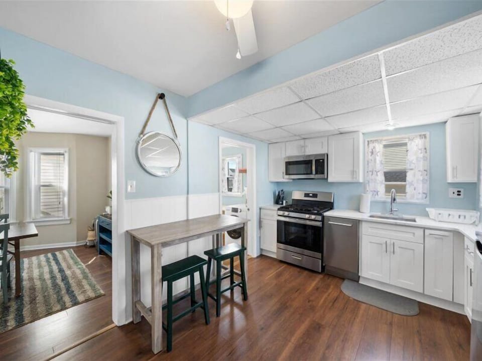 Relax after a day in the sun—this comfy living room invites conversation, board games, or movie nights in.