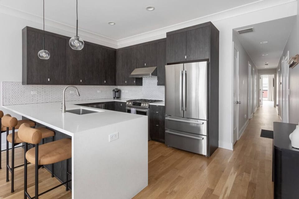 Fully stocked chef’s kitchen featuring stainless steel appliances, a Keurig coffee maker, and all the essentials to cook your favorite meals!
