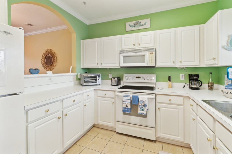 Condo, 2 Bedrooms | Private kitchen | Coffee/tea maker, fridge, oven, toaster