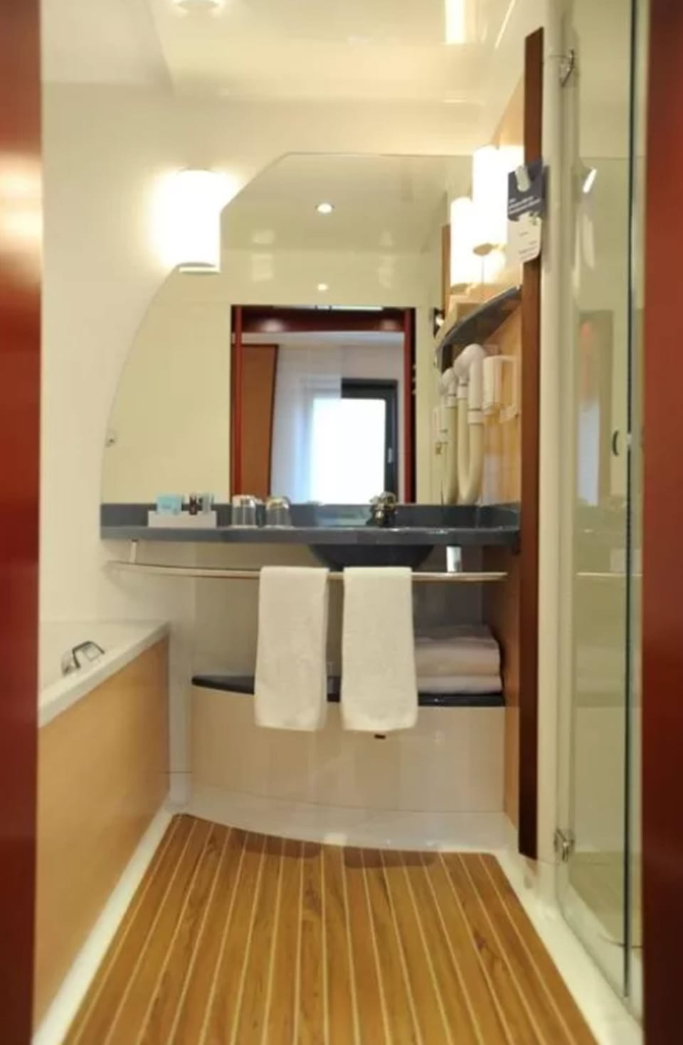 Separate tub and shower, eco-friendly toiletries, hair dryer, towels