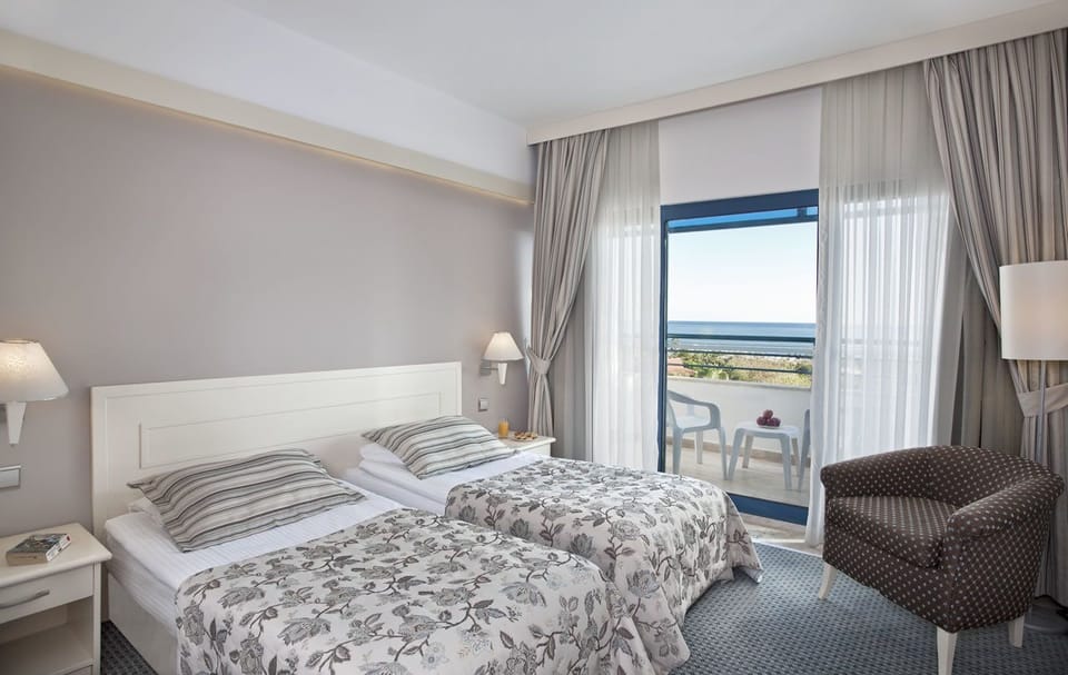 Main Building Sea View Room | Free minibar, in-room safe, desk, free cribs/infant beds