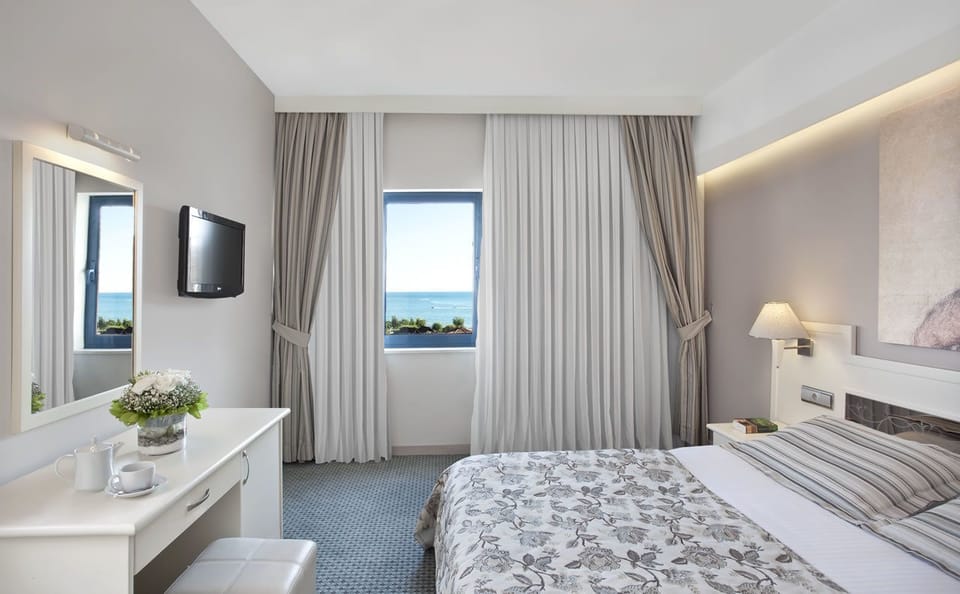 Main Building Sea View Room | Free minibar, in-room safe, desk, free cribs/infant beds
