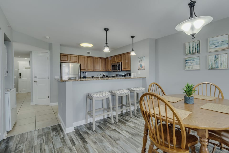 Gather around your spacious kitchen island for morning coffee or enjoy family meals at the dining table in this bright, modern space.
