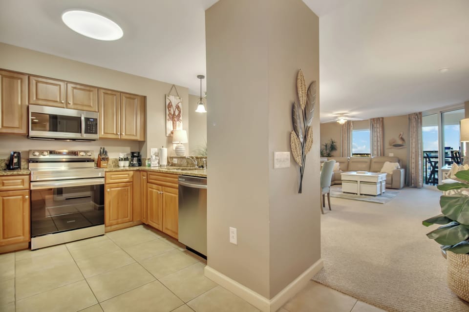 Cook together in your spacious open kitchen, featuring modern appliances and flowing seamlessly into the welcoming living area.
