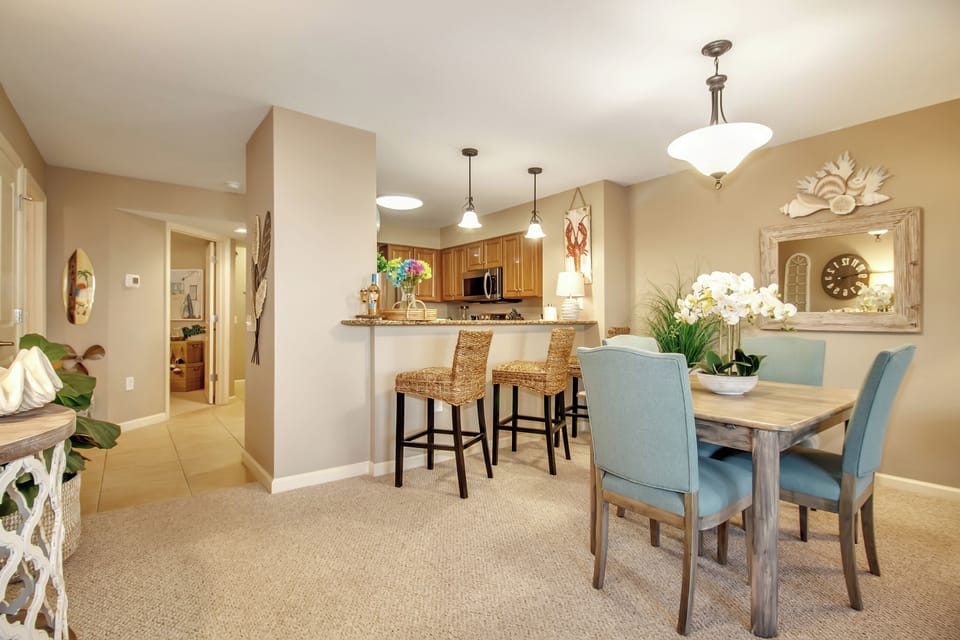 Gather around your elegant dining table while staying connected to the kitchen—perfect for entertaining friends or enjoying morning coffee together.