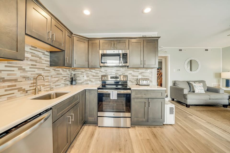 Beachy Cabinetry and gorgeous Backsplash.