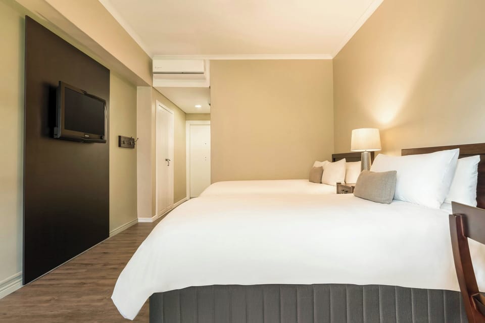 Family Room, 2 Double Beds | Minibar, in-room safe, desk, laptop workspace