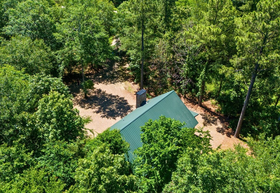 A bird’s-eye peek at the cabin, nestled deep in the woods and perfectly secluded for total privacy and tranquility.